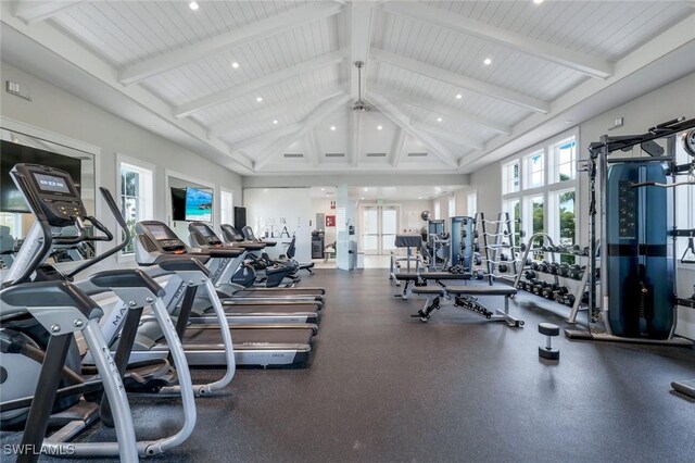 exercise room with high vaulted ceiling and recessed lighting