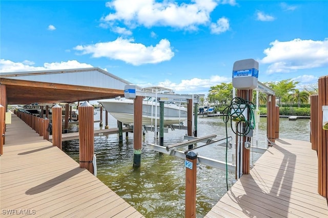 dock area featuring a water view and boat lift