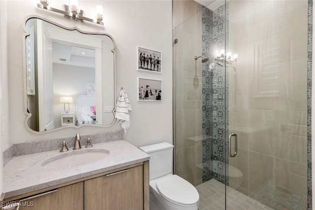 ensuite bathroom featuring toilet, ensuite bath, a shower stall, and vanity