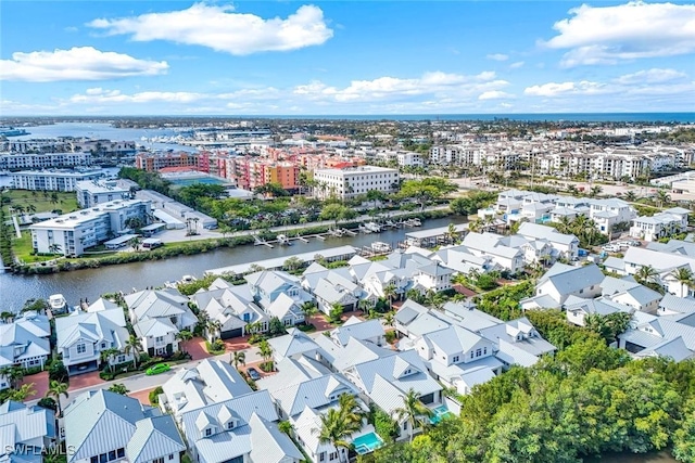 birds eye view of property featuring a water view and a residential view