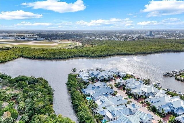 birds eye view of property with a residential view and a water view