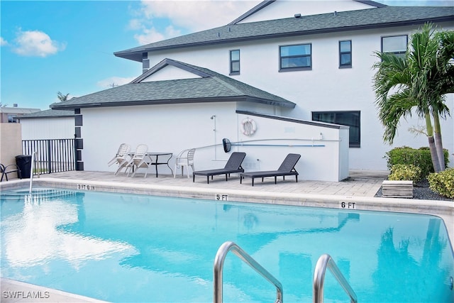 view of swimming pool featuring a patio