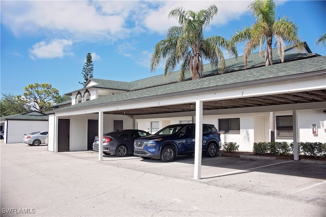 view of vehicle parking with a carport