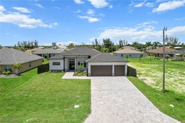 view of front facade with a front lawn and a garage