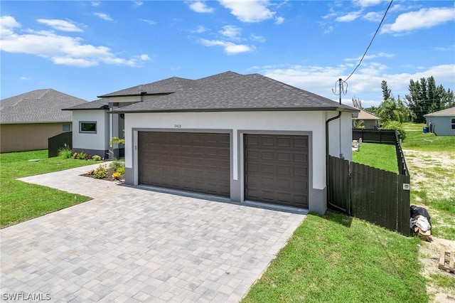 exterior space featuring a front yard and a garage