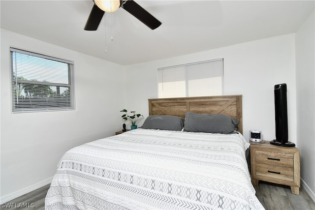 bedroom featuring ceiling fan and wood-type flooring