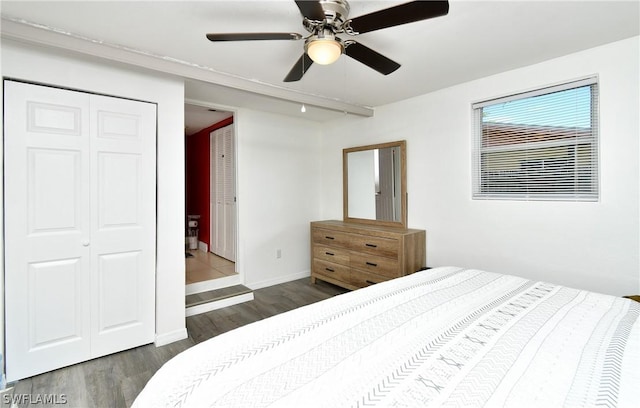 1235 Joerin Ave, North Fort Myers, FL 33903 - bedroom with baseboards, dark wood-style floors, a closet, and a ceiling fan