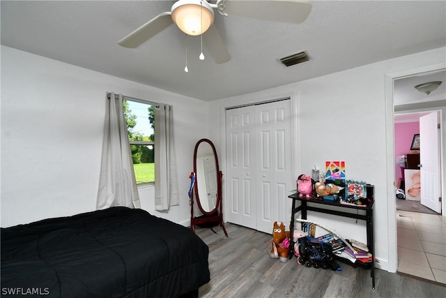 1235 Joerin Ave, North Fort Myers, FL 33903 - bedroom with a closet, wood finished floors, baseboards, visible vents, and ceiling fan