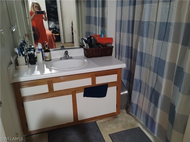 bathroom with tile patterned flooring and vanity