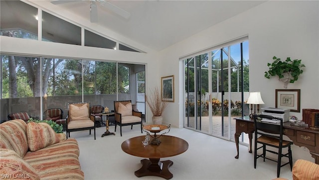 sunroom featuring lofted ceiling and ceiling fan