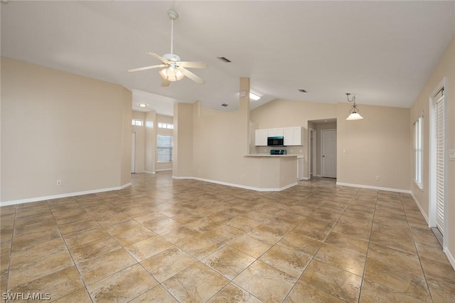 unfurnished living room with ceiling fan and vaulted ceiling