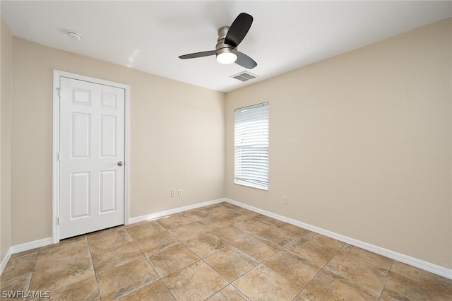 spare room featuring ceiling fan