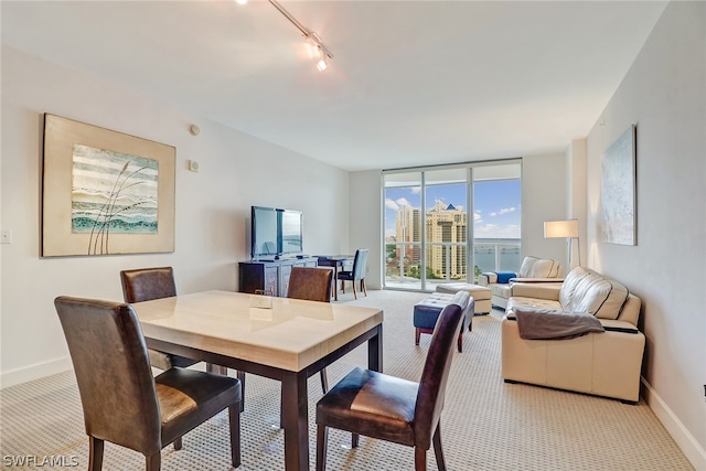 3000 Oasis Grand Blvd Unit 1704, Fort Myers, FL 33916 - dining area featuring light colored carpet and rail lighting