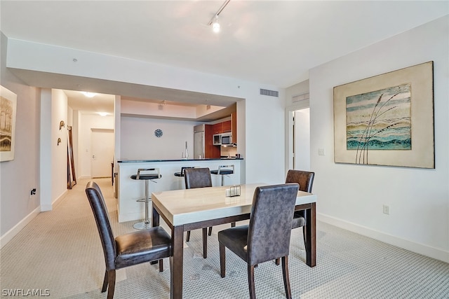 3000 Oasis Grand Blvd Unit 1704, Fort Myers, FL 33916 - dining room with light carpet and baseboards