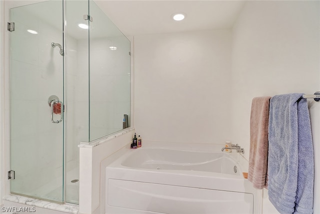 3000 Oasis Grand Blvd Unit 1704, Fort Myers, FL 33916 - full bathroom with a garden tub, a shower stall, and recessed lighting