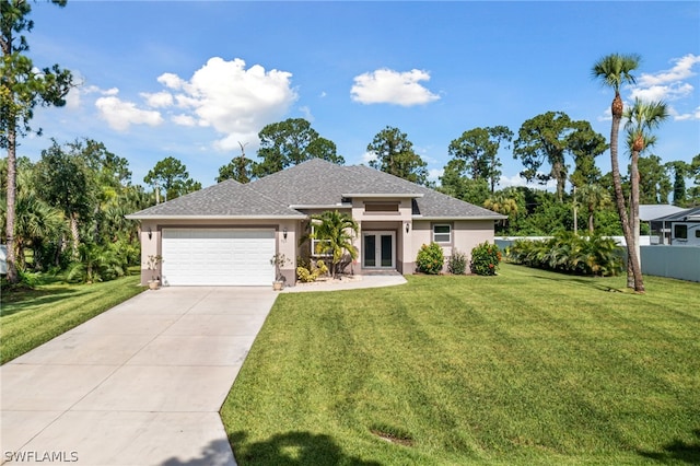 view of front of property featuring a front lawn, french doors, and a garage