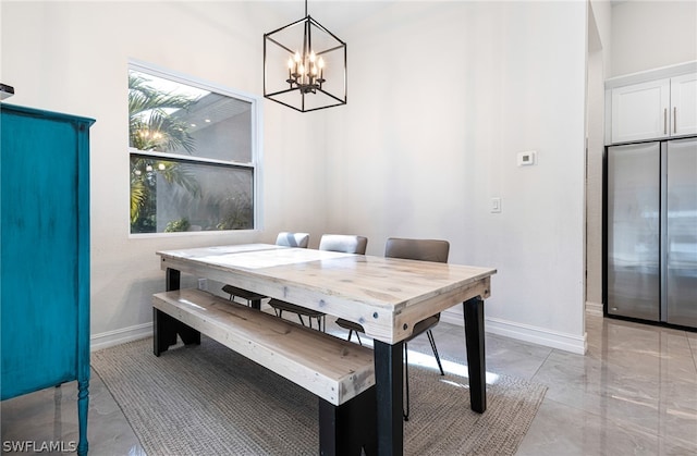 dining space with a chandelier