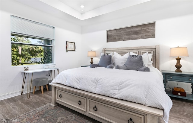 bedroom with dark wood-type flooring