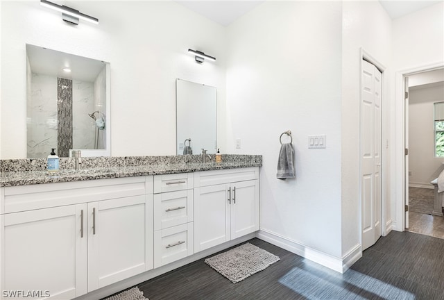 bathroom featuring vanity and a shower