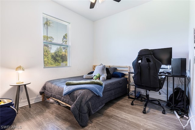 bedroom featuring ceiling fan and hardwood / wood-style floors