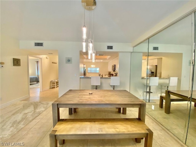 dining room with light tile patterned floors