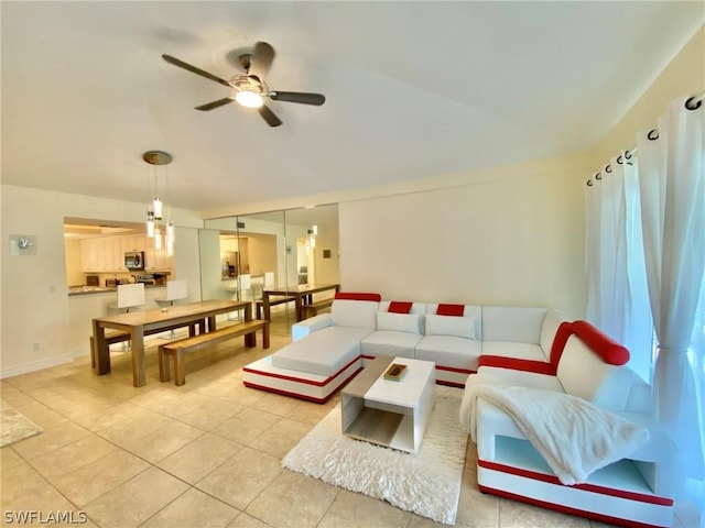 tiled living room with ceiling fan