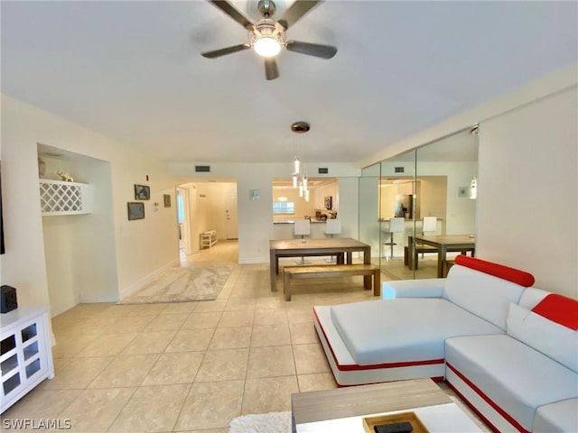 tiled living room featuring ceiling fan