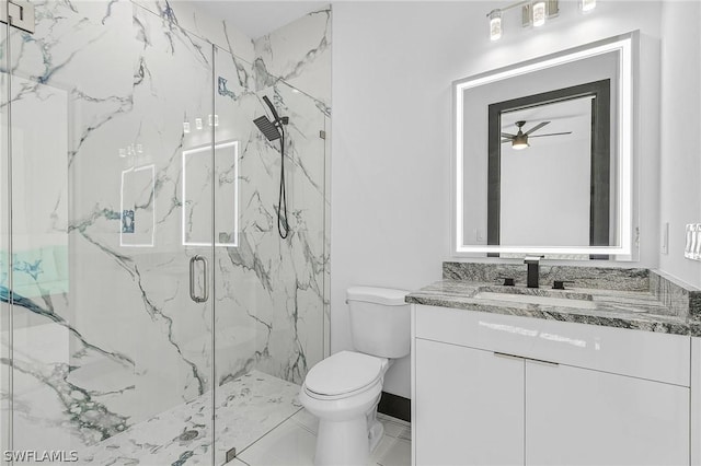 bathroom with walk in shower, vanity, and toilet