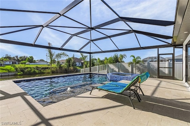 view of swimming pool with a patio, an in ground hot tub, and glass enclosure