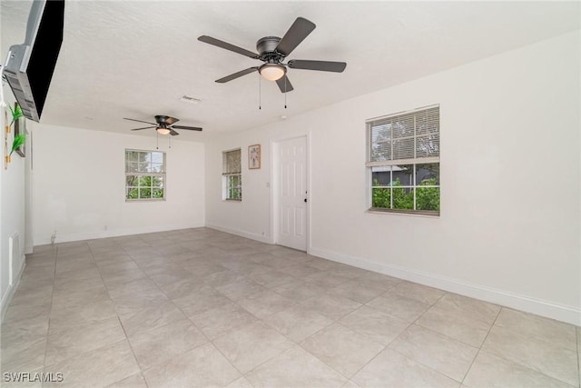 empty room featuring a textured ceiling