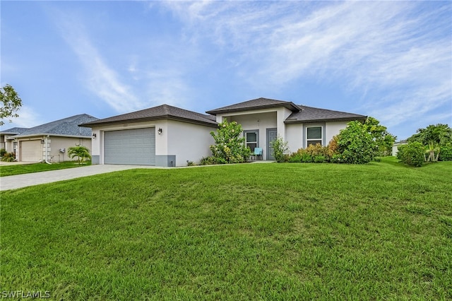 view of front of house with a garage and a front lawn