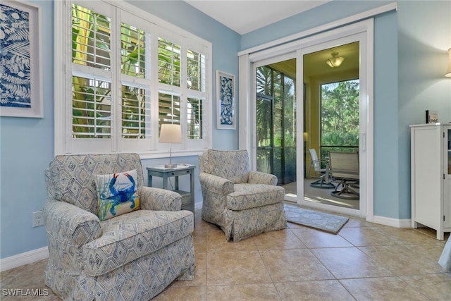 living area with light tile patterned floors