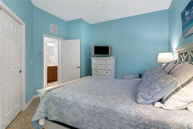 carpeted bedroom with a closet