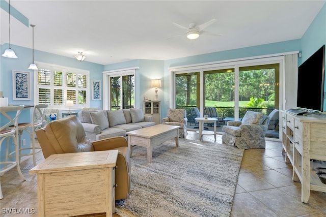 living room with light tile patterned floors and ceiling fan