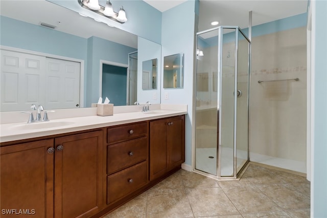 bathroom featuring vanity and a shower with shower door