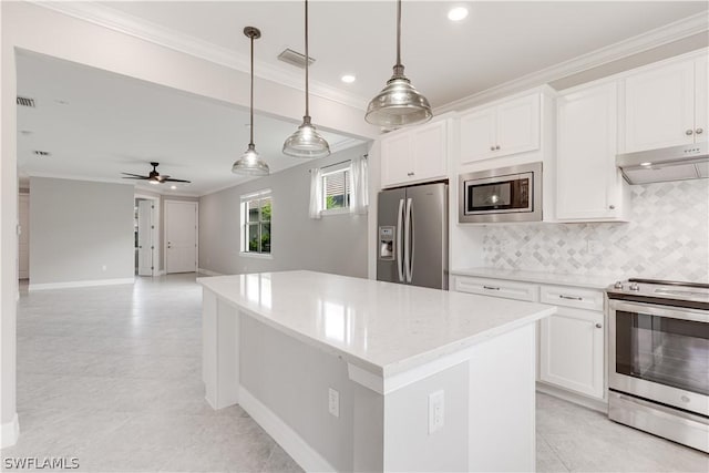 kitchen featuring appliances with stainless steel finishes, ceiling fan, white cabinets, and pendant lighting