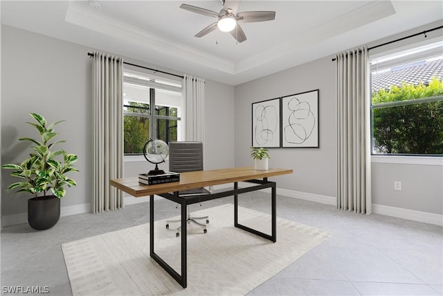 office area featuring a raised ceiling, ceiling fan, light tile patterned floors, and crown molding