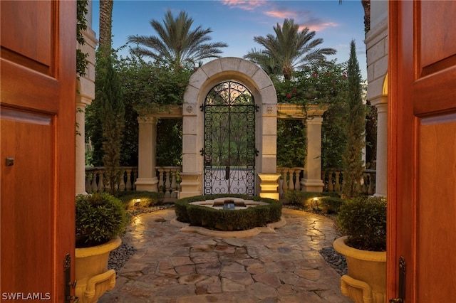 view of patio terrace at dusk