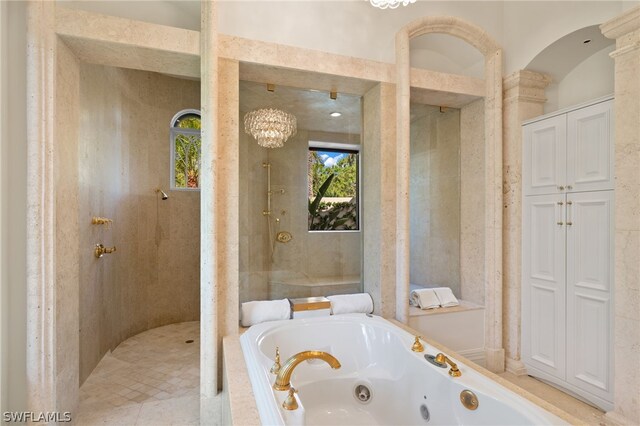 bathroom with separate shower and tub