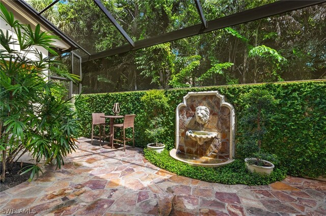 view of patio with a lanai