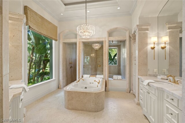 bathroom featuring crown molding, vanity, a tray ceiling, and a notable chandelier