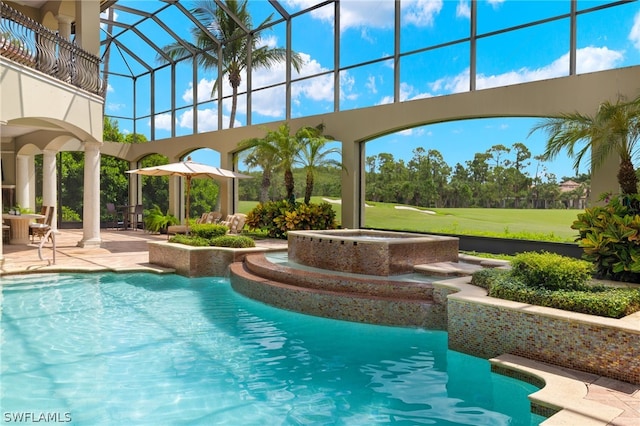 view of pool featuring an in ground hot tub, glass enclosure, and a patio area