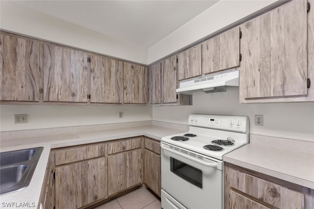 kitchen with white range with electric cooktop, sink, and light tile patterned floors