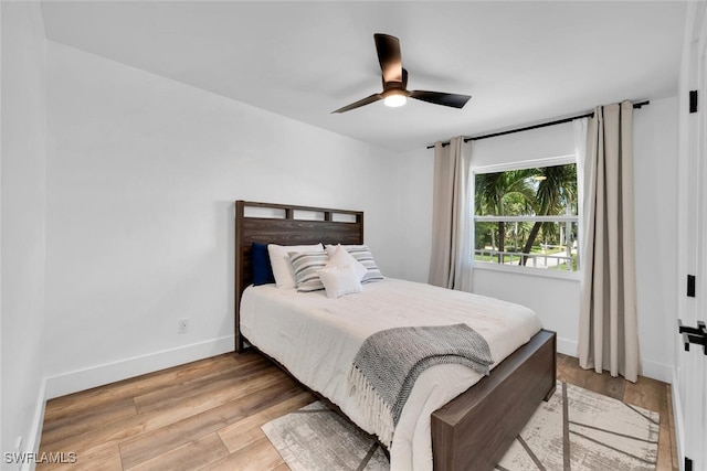 bedroom featuring light hardwood / wood-style flooring and ceiling fan