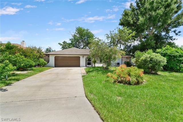 view of front of home with a garage and a front yard