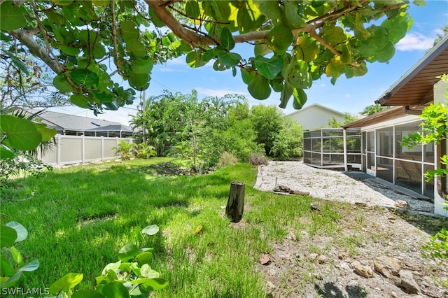 view of yard featuring a sunroom