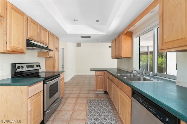 kitchen with sink, light brown cabinets, light tile patterned floors, a raised ceiling, and stainless steel appliances