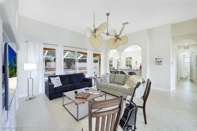 living room featuring light tile patterned floors and a notable chandelier