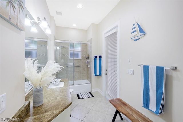 full bathroom with enclosed tub / shower combo, vanity, toilet, and tile patterned flooring