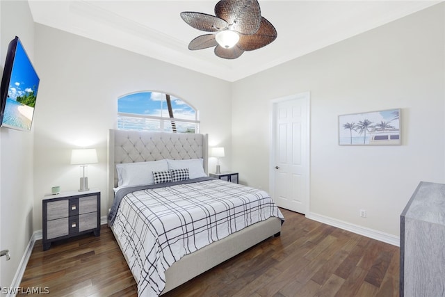 bedroom with ceiling fan, ornamental molding, and dark hardwood / wood-style floors